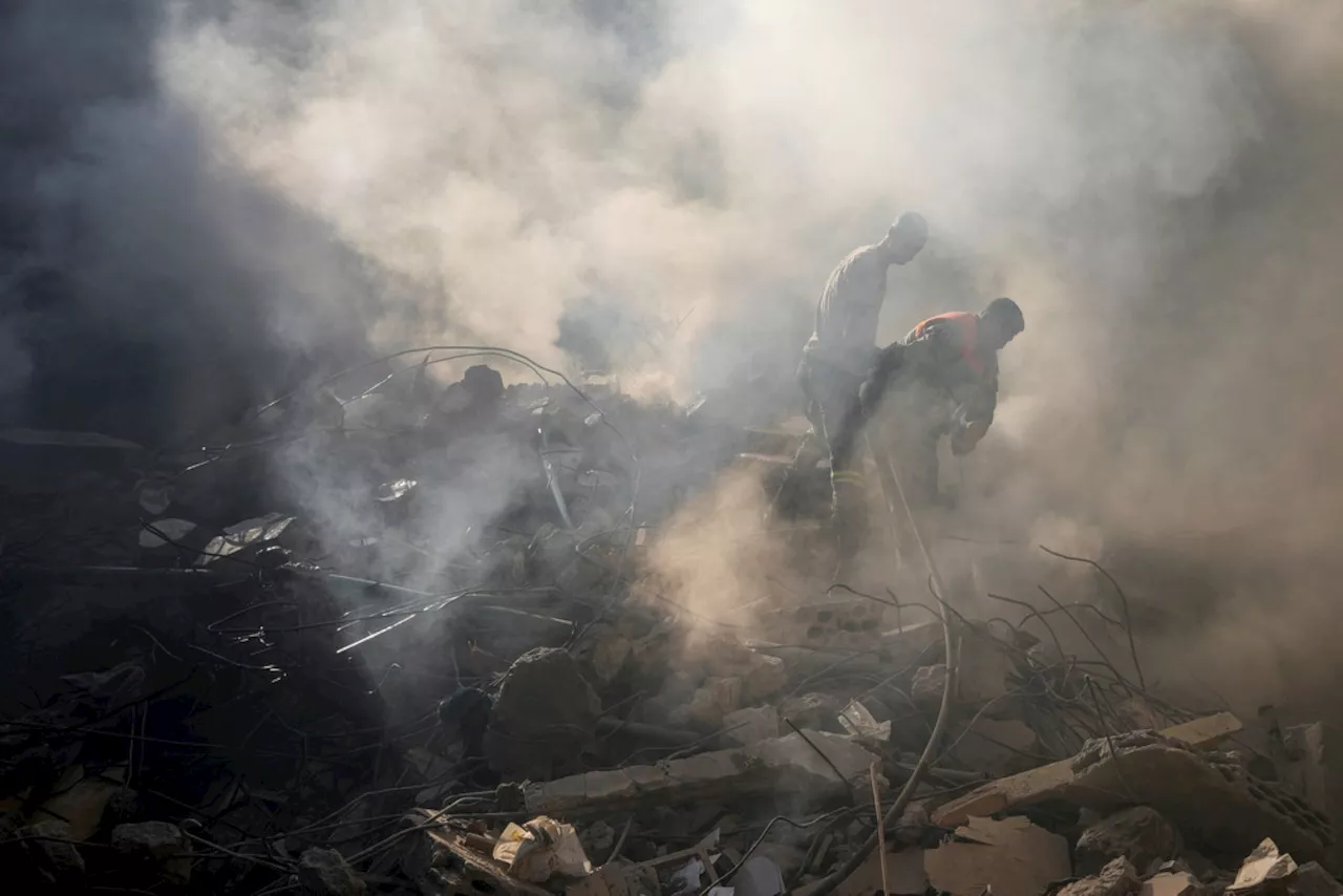 Israel's deadliest strike in central Beirut leaves Lebanese stunned as they dig through the rubble