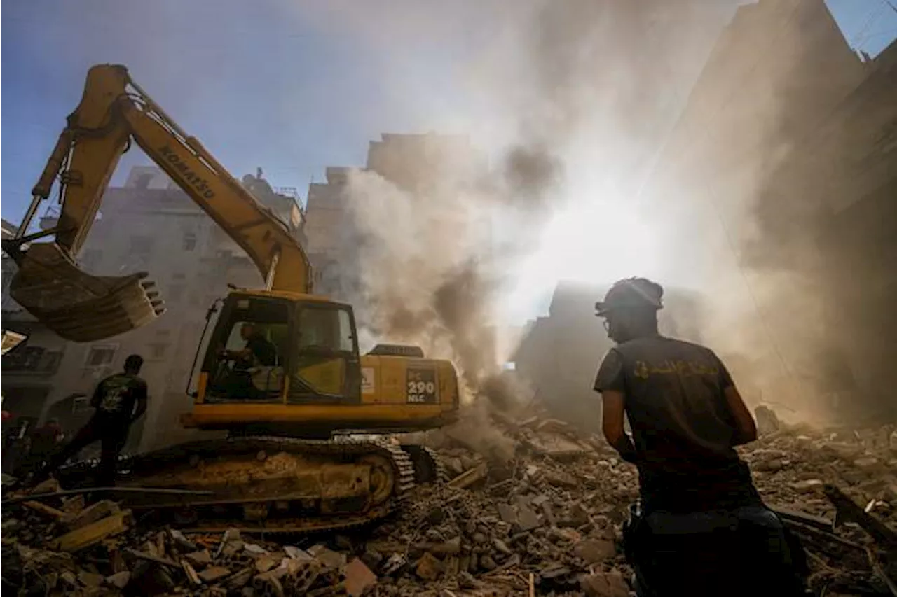 Israel's deadliest strike in central Beirut leaves Lebanese stunned as they dig through the rubble