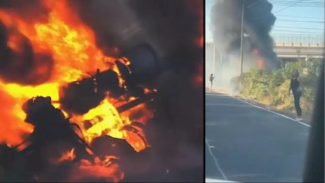 Amid intense flames, bystanders pull driver to safety from burning 18-wheeler