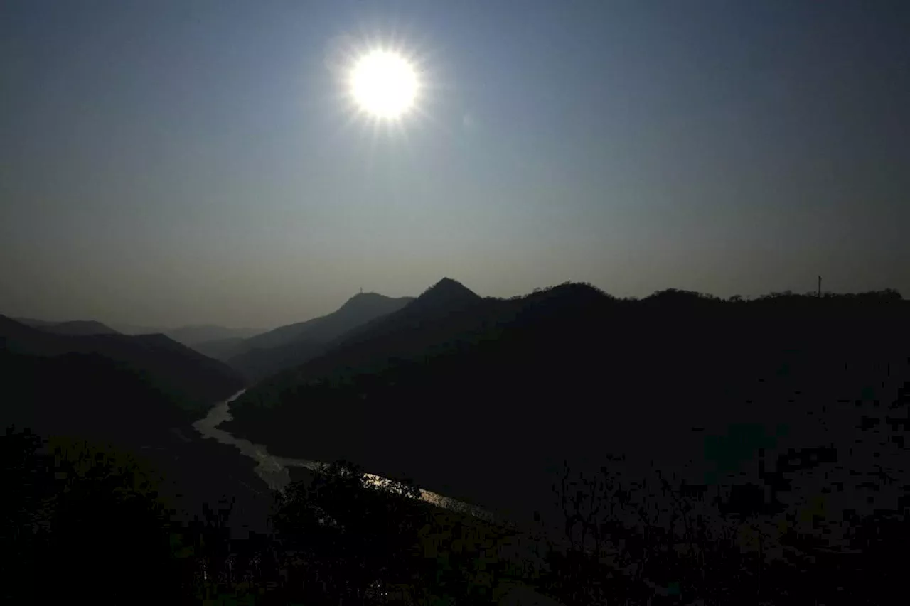 Drought is parching the world's largest man-made lake, stripping Zambia of its electricity