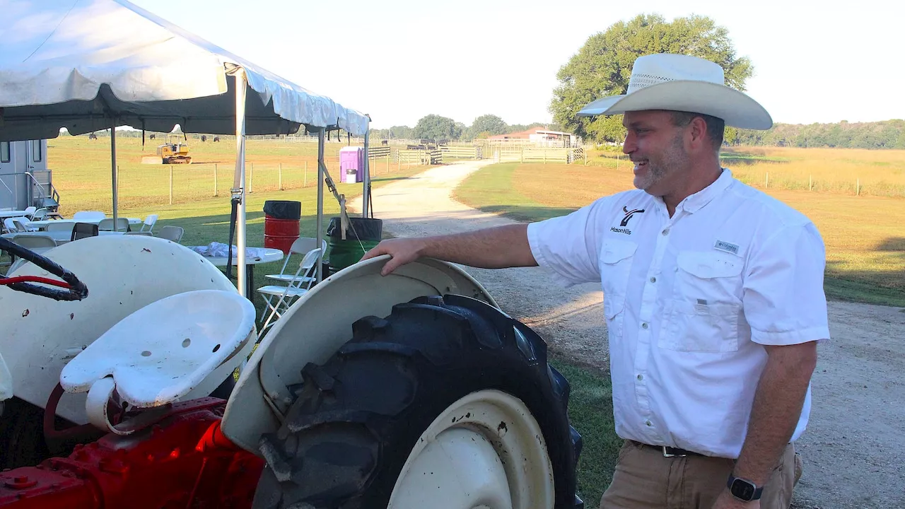 Mobile area cattle farm opening gates for barbecue fest