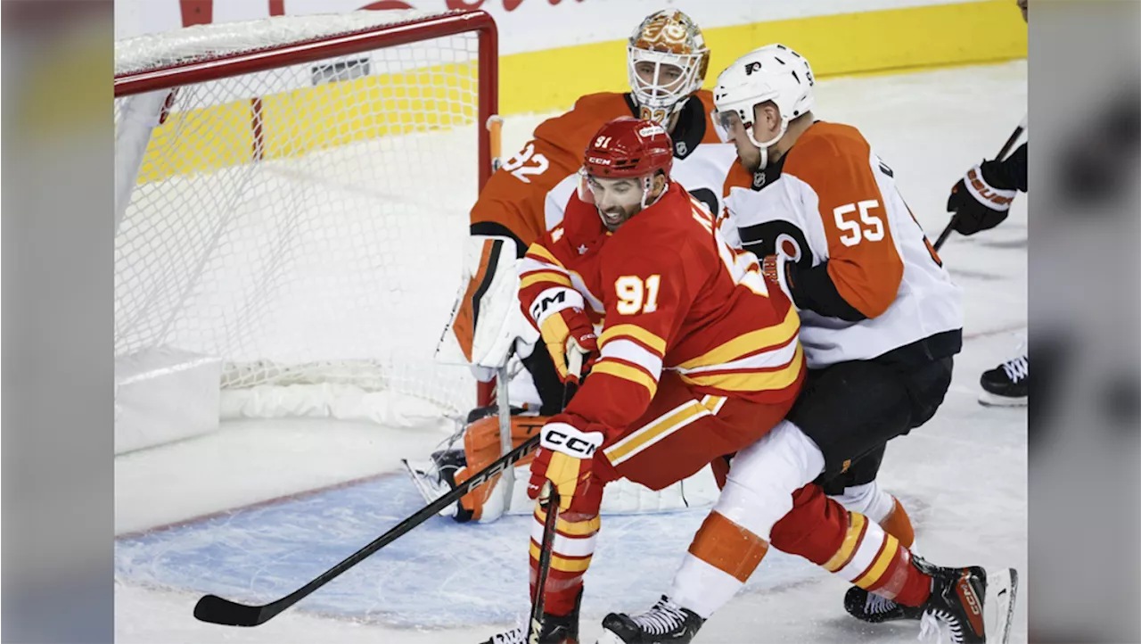 Huberdeau scores twice, Wolf has 37 saves in Flames' 6-3 win over Flyers