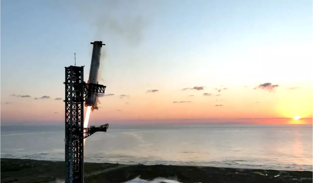 SpaceX catches Starship rocket booster in dramatic landing during fifth flight test