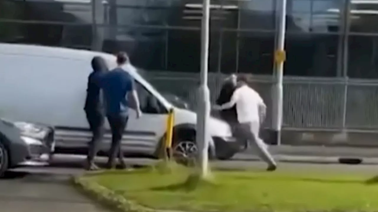 Terrifying moment armed road-rage thugs smash white van as driver flees onslaught outside Tesco Extra...