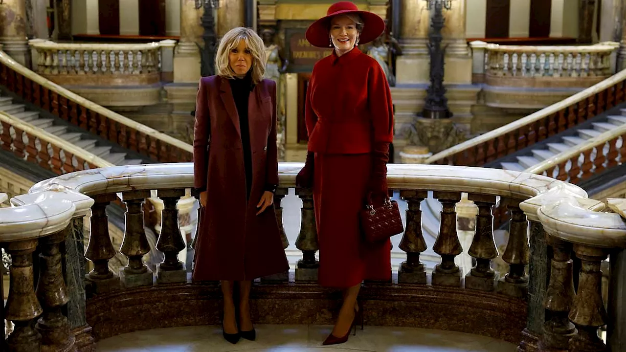 Queen Mathilde of Belgium stuns in cherry ensemble as she meets with French President Emmanuel...