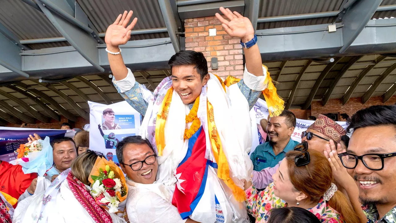 Hero's welcome for record-breaking Nepal teenager after climbing world's highest peaks