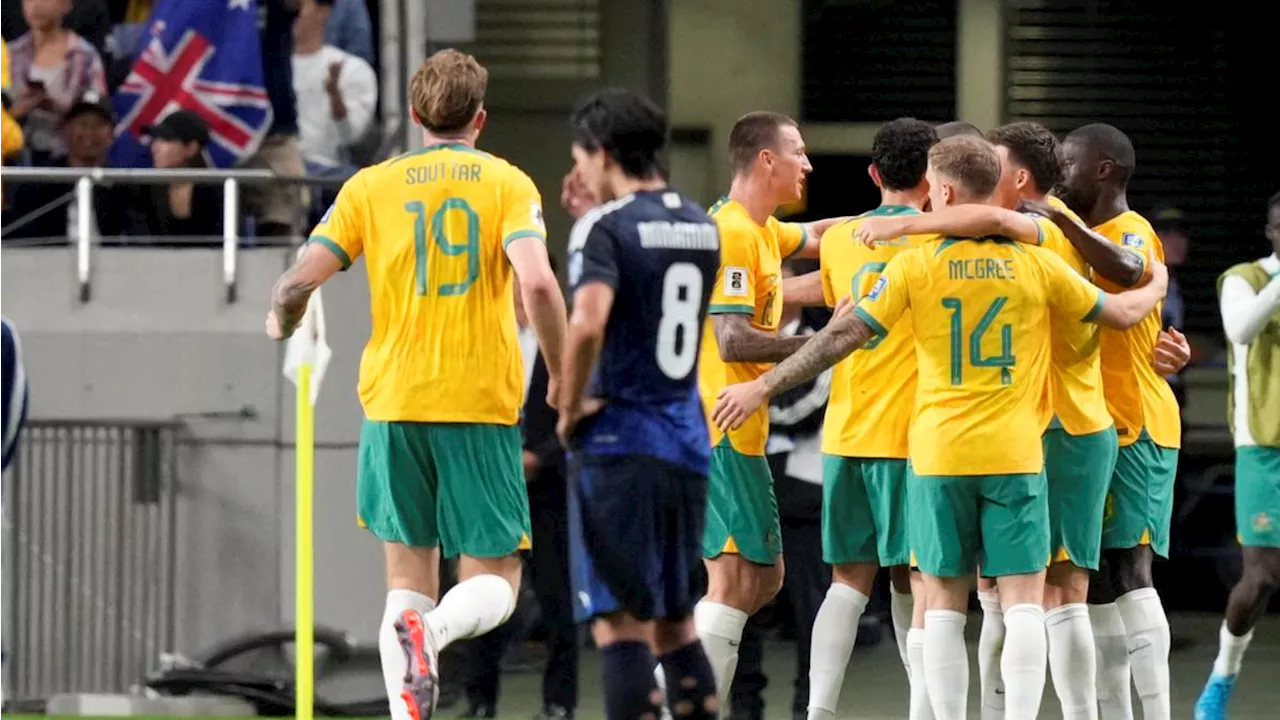 Socceroos let lead slip but hang on for draw with Japan in World Cup qualifier