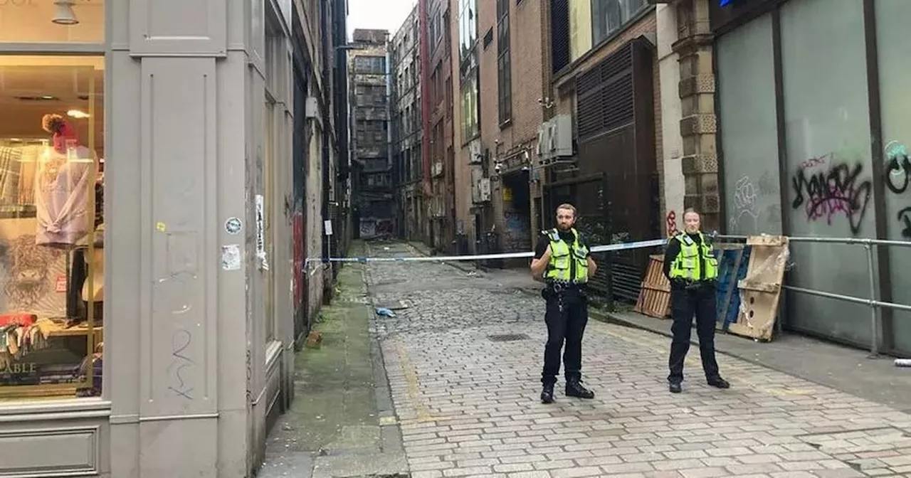 Busy Glasgow street taped off by police after man found injured