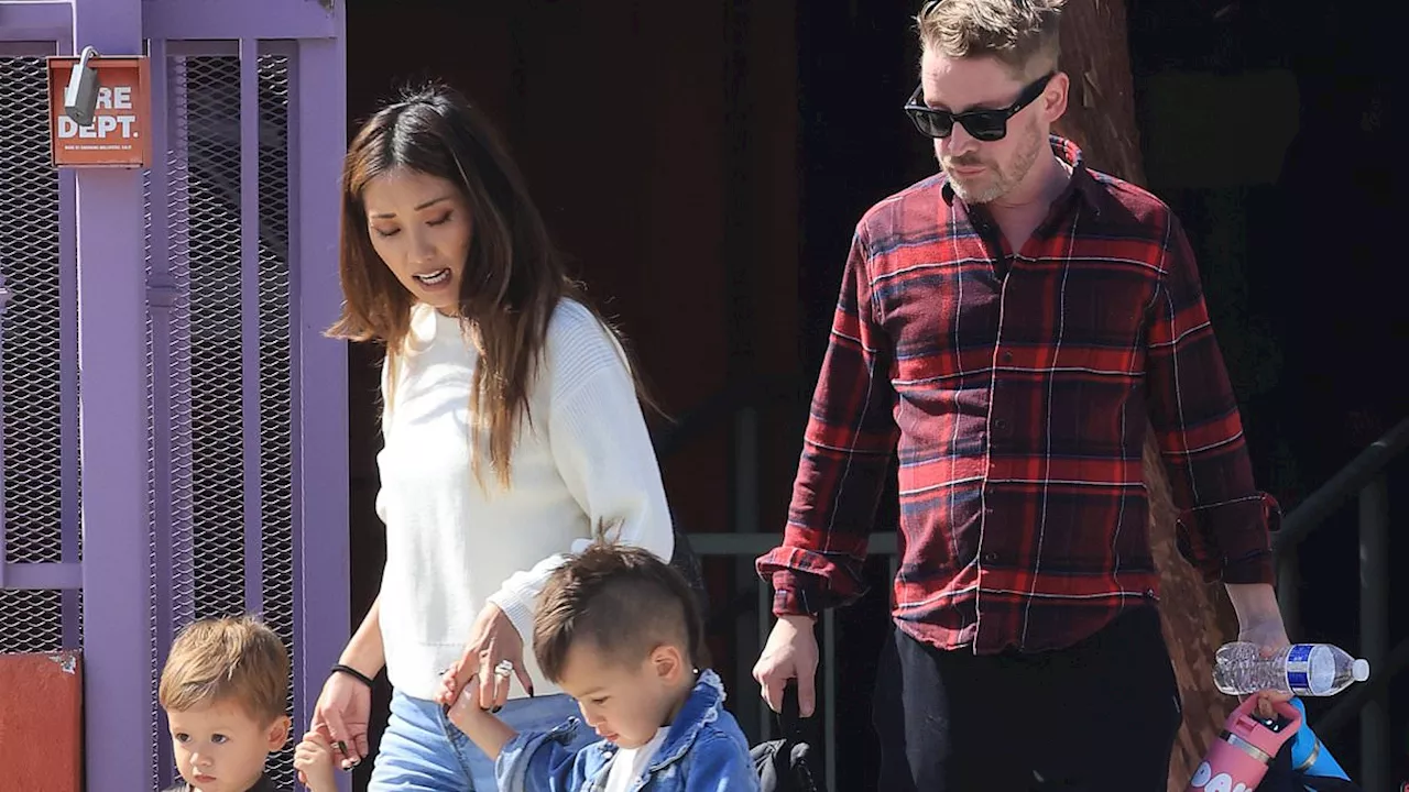 Macaulay Culkin models pink Crocs as he and fiancée Brenda Song take their sons to a park in LA