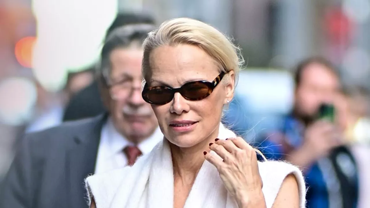 Pamela Anderson turns heads in glamorous knit dress and stiletto heels