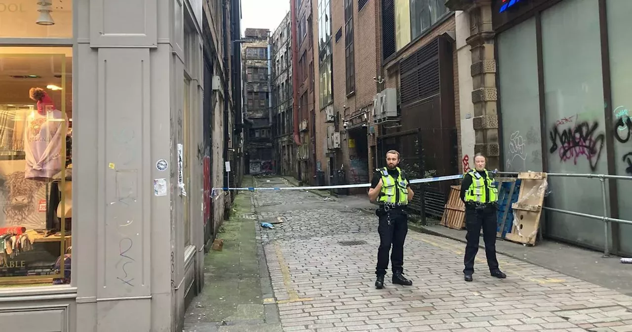 Glasgow city centre road taped off after man found injured as police rush to scene