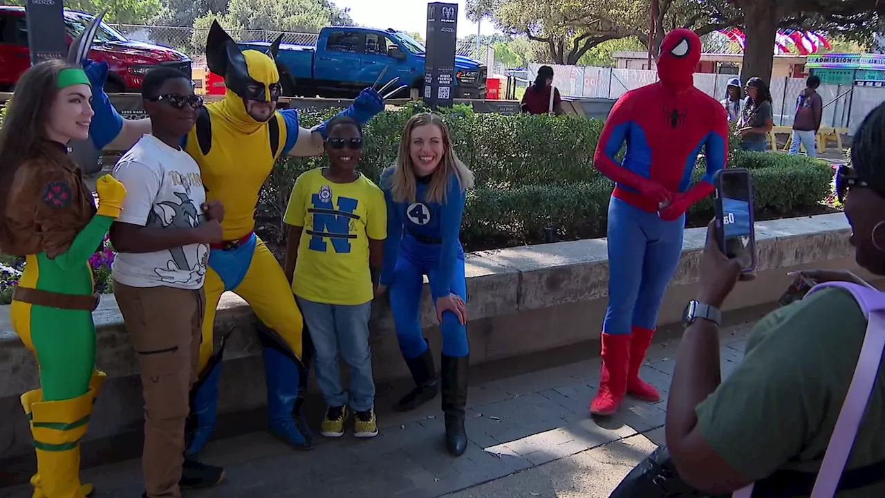 Cops in superhero costumes greet young fairgoers during final week of 2024 State Fair of Texas