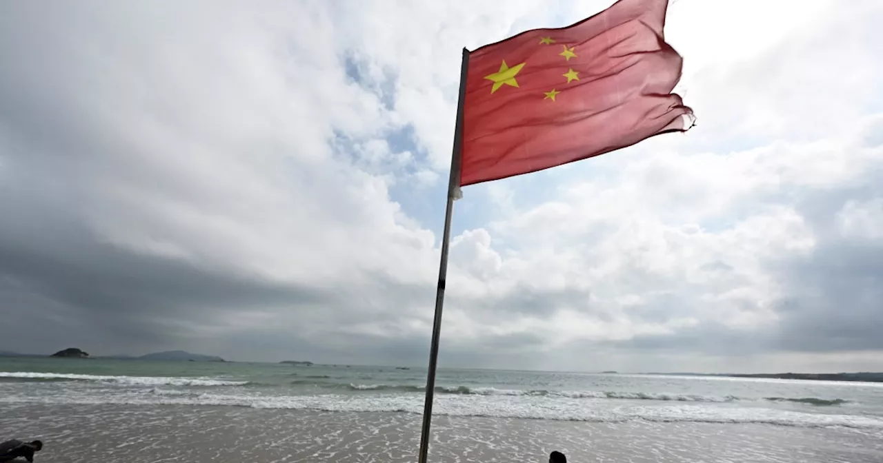 Taiwan says Chinese military sent a record 153 planes toward island during war games