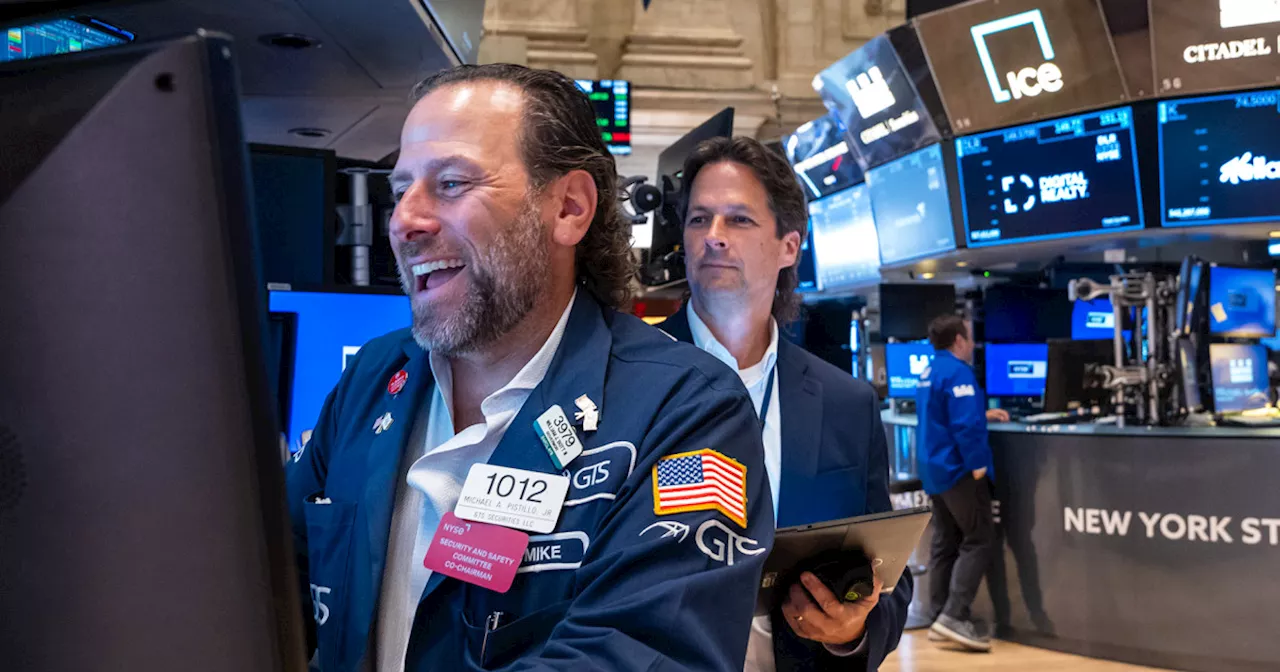 Dow adds 200 points for first close above 43,000