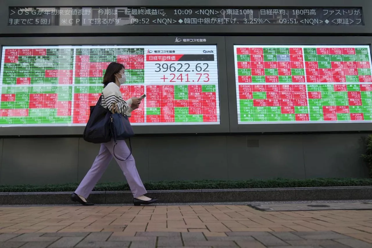 Stock market today: Asian shares are mixed after Wall St powers to more records