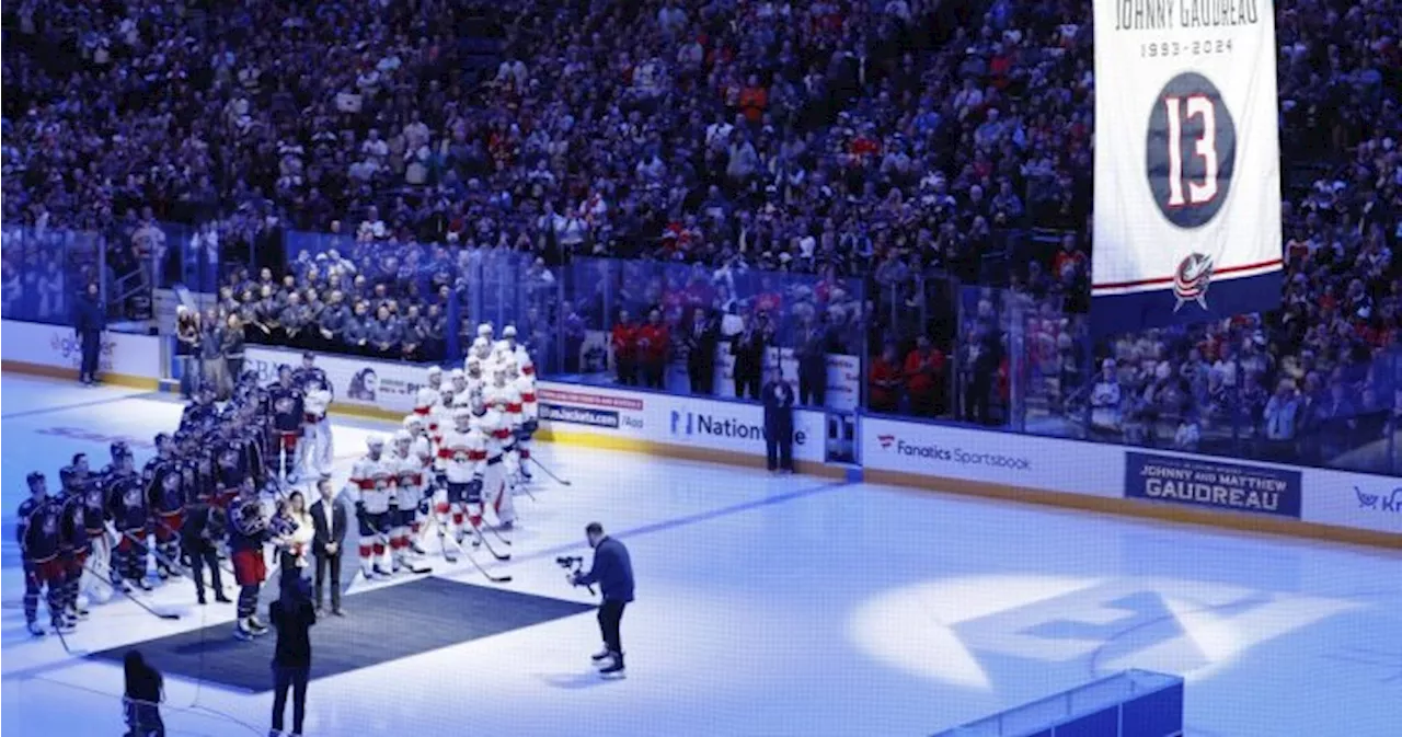 IN PHOTOS: Columbus Blue Jackets raise banner in honour of Johnny Gaudreau at home opener