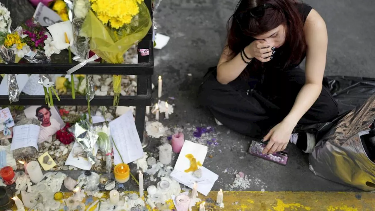 Saddened Liam Payne fans leave flowers and light candles outside Buenos Aires hotel