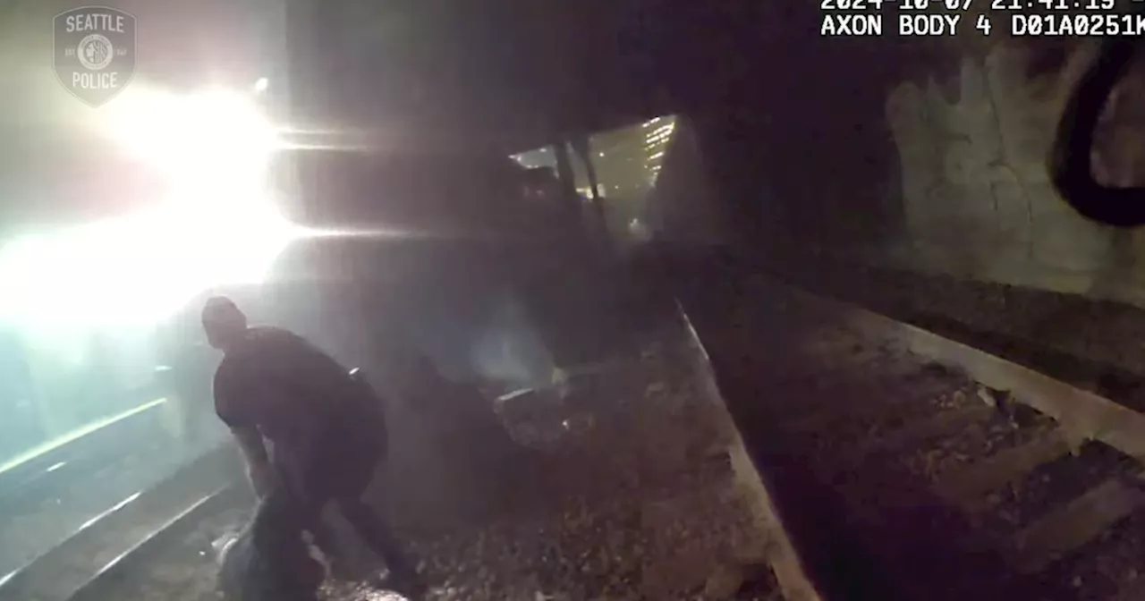 Video shows Seattle police pull injured man from tracks just seconds ahead of oncoming train