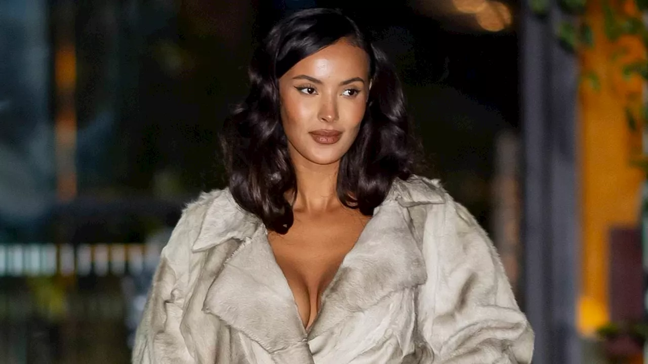 Maya Jama exudes glamour as she goes braless in a fur trench coat for the reopening of Burberry's...