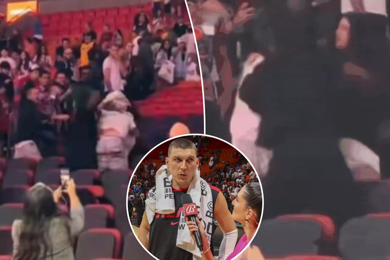 Heat fans get in vicious brawl — distracting Tyler Herro during TV interview