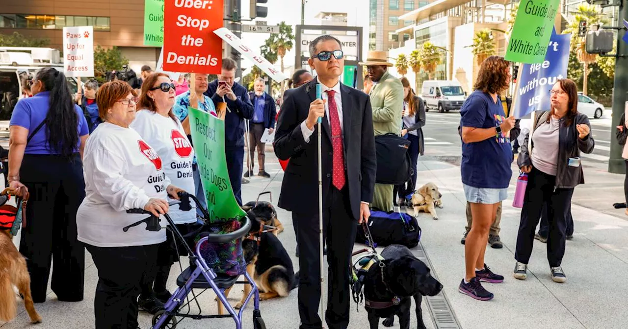 Visually impaired people protest at Uber HQ