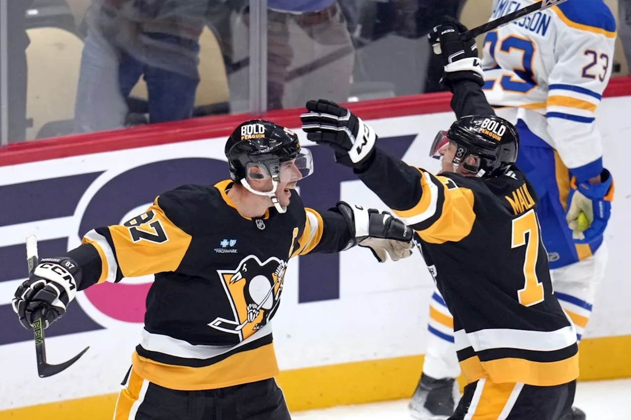 Penguins' stars reach career milestones in OT win over Sabres