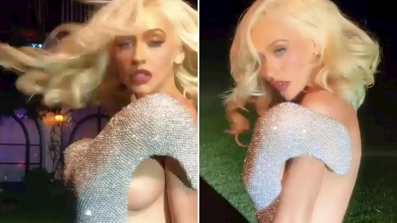 Christina Aguilera posts sizzling video showing off side boob as she dances in silver dress...