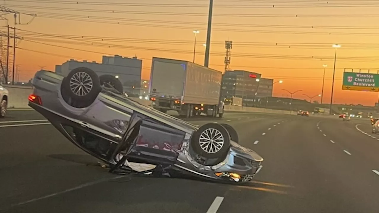 Stolen vehicle flips onto roof on Highway 401 in Mississauga