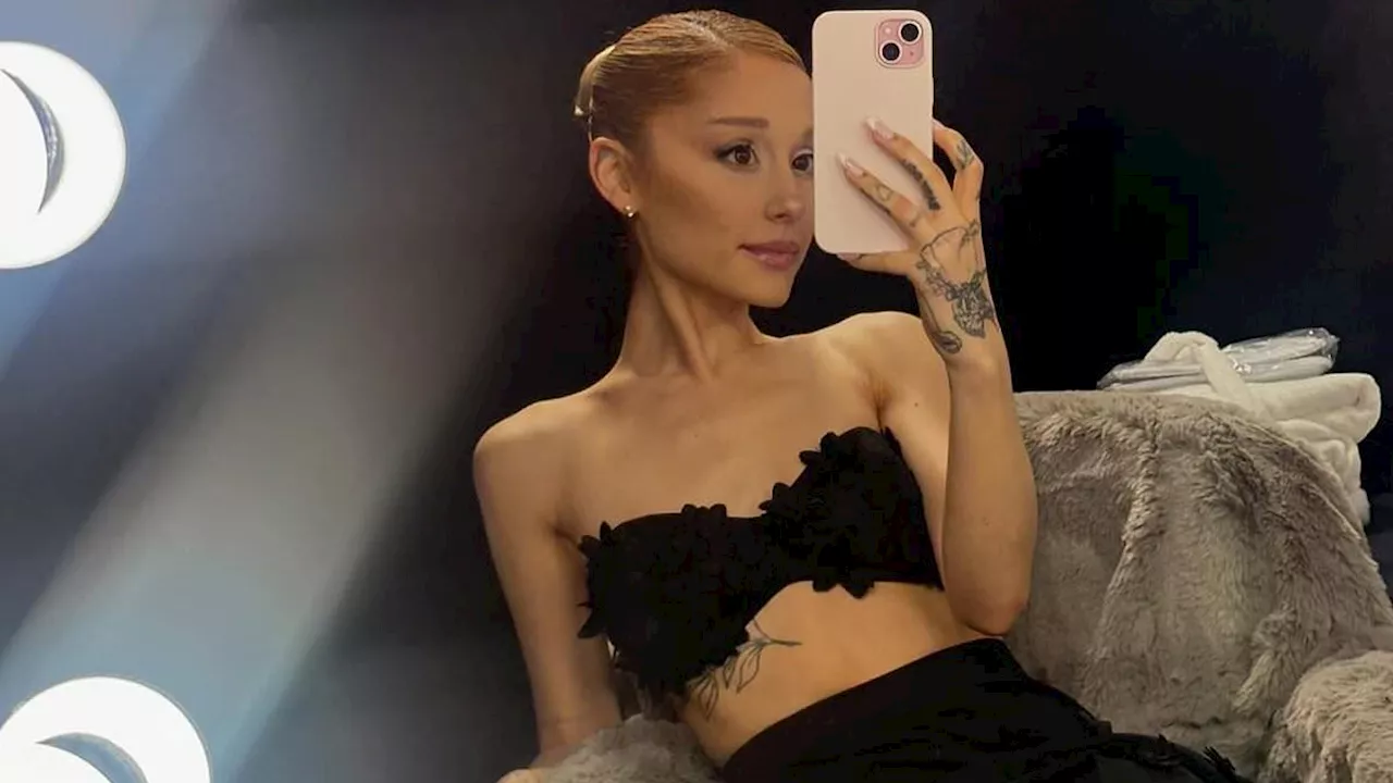 Ariana Grande flashes her tummy in a bra top after controversy over her Wicked poster