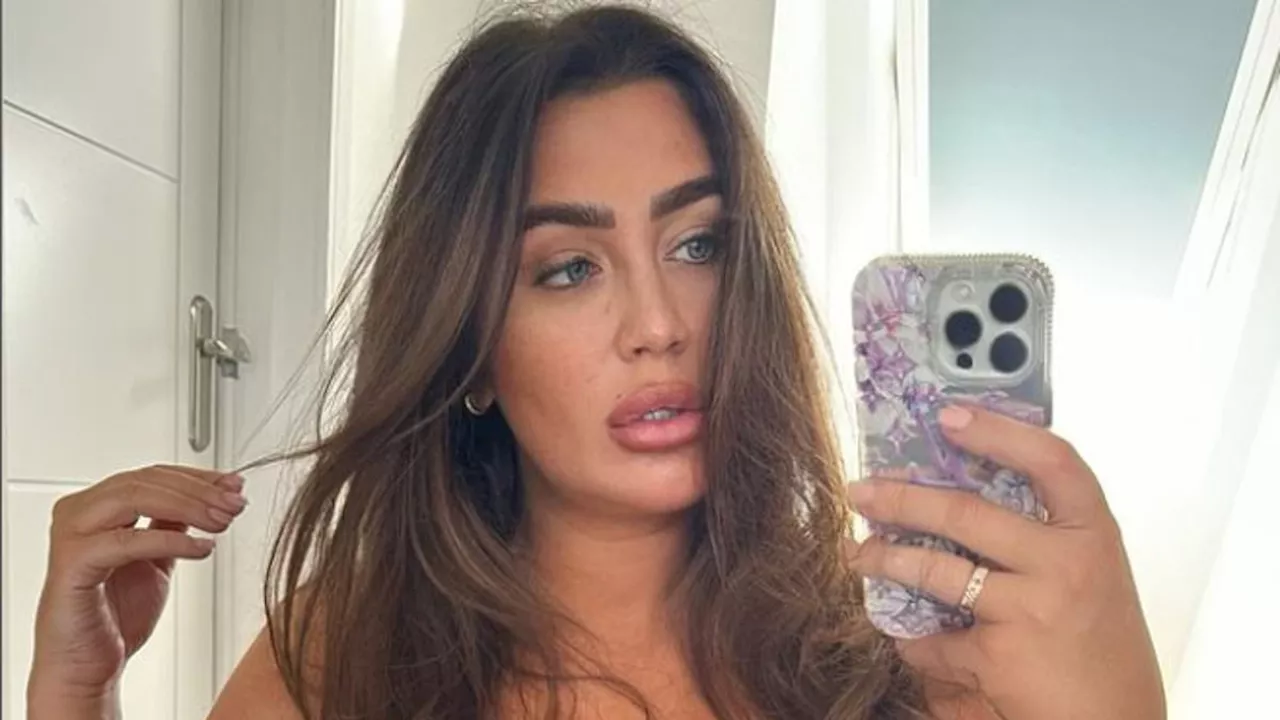 Lauren Goodger puts on a VERY busty display in tight grey crop top as she poses for sizzling snaps