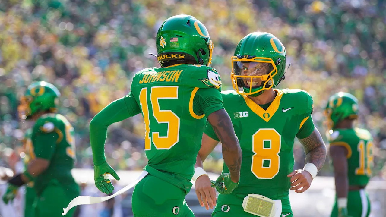 Oregon Ducks Quarterback Dillon Gabriel, Wide Receiver Tez Johnson Chase NCAA Records