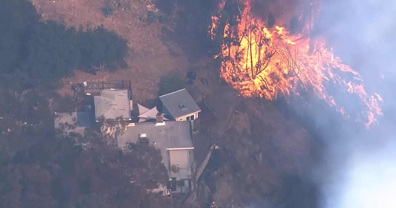 Fire burns hillside homes in Oakland amid day of high winds; residents evacuated