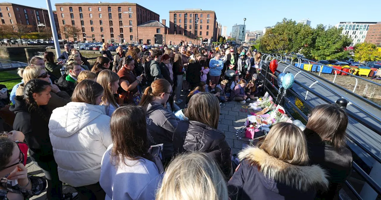 Crowd in tears at Liam Payne vigil in Liverpool as they sing One Direction songs