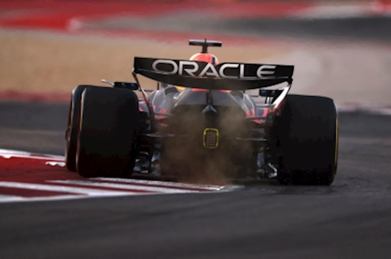 Motor sports inspectors check on Red Bull race car in Formula One qualifier after rival McLaren gripes about ride-adjustment device