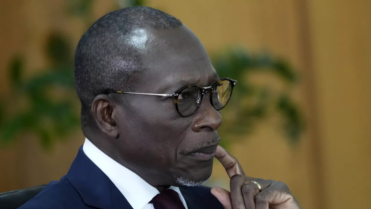 Two men close to Benin's president jailed after alleged coup plot