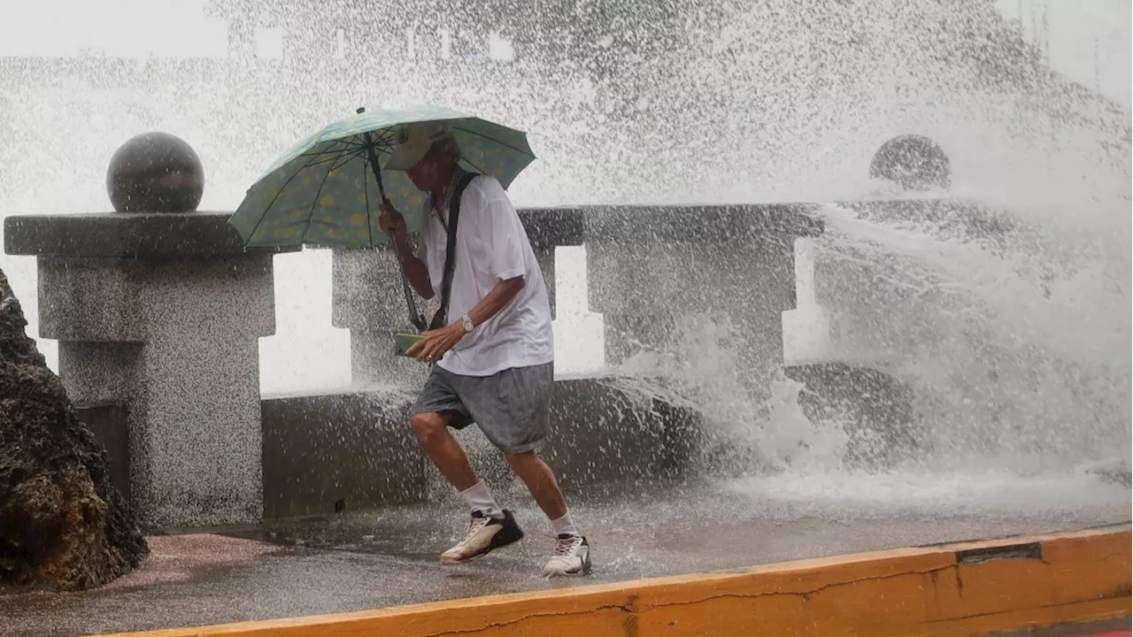 Typhoon headed to Taiwan injures dozens, with thousands evacuated