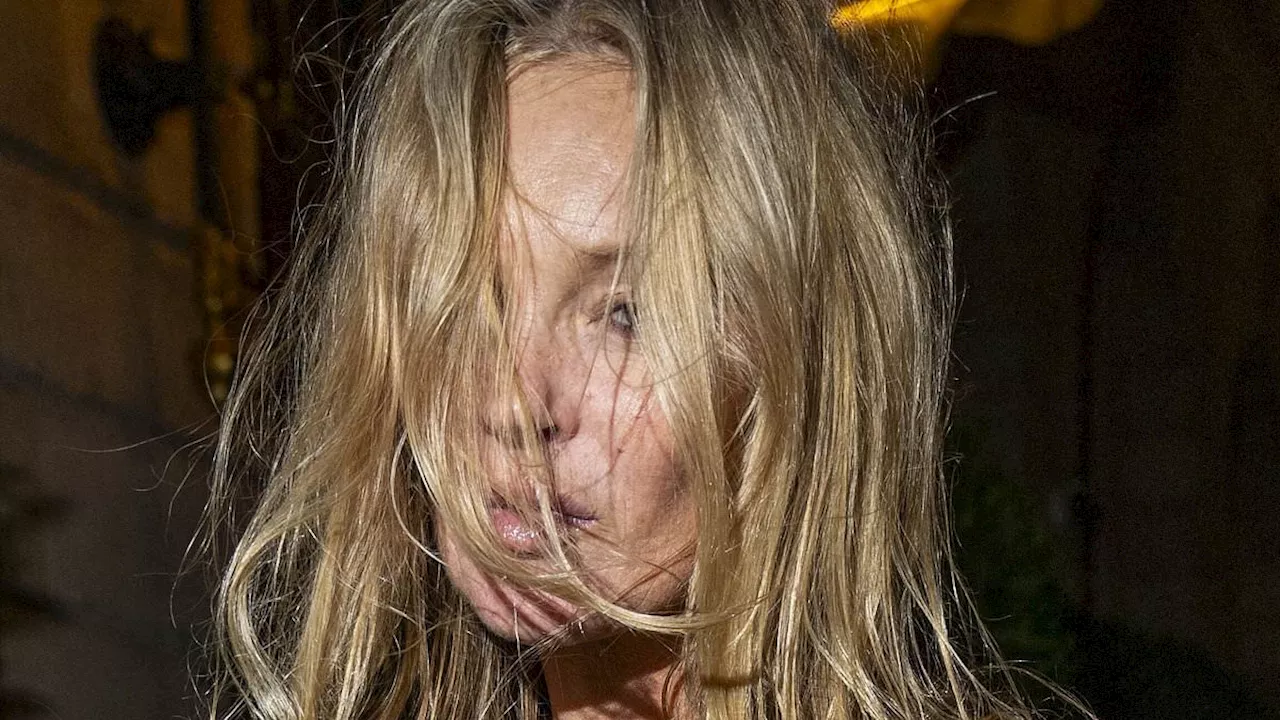 Kate Moss takes a tumble while enjoying cigarette at Paris restaurant