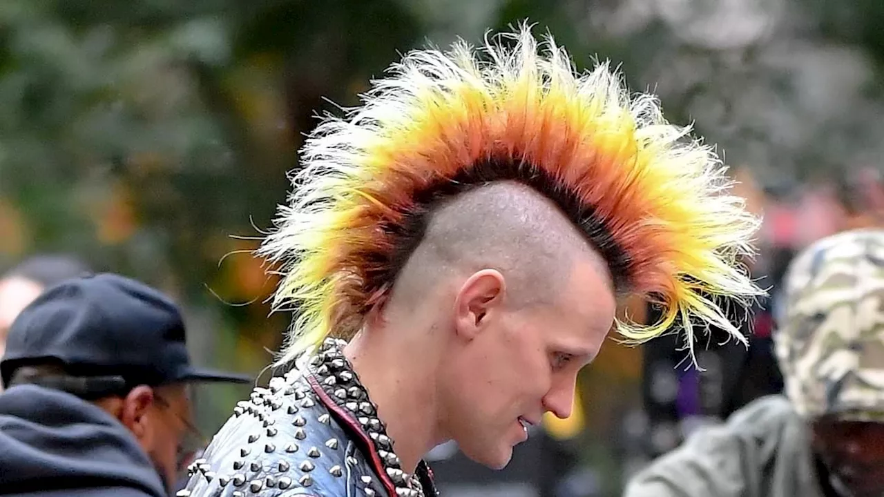 Matt Smith looks worlds away from his usual self as he sports enormous multicoloured Mohawk while...