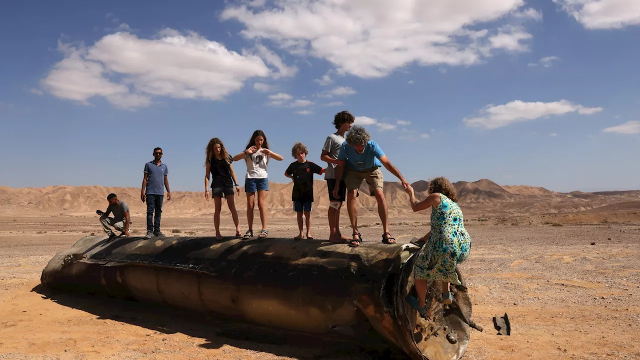 Defiant kids play on Iranian rocket as Israelis hail ‘miracle of Tel Aviv’ after just one killed in 181...