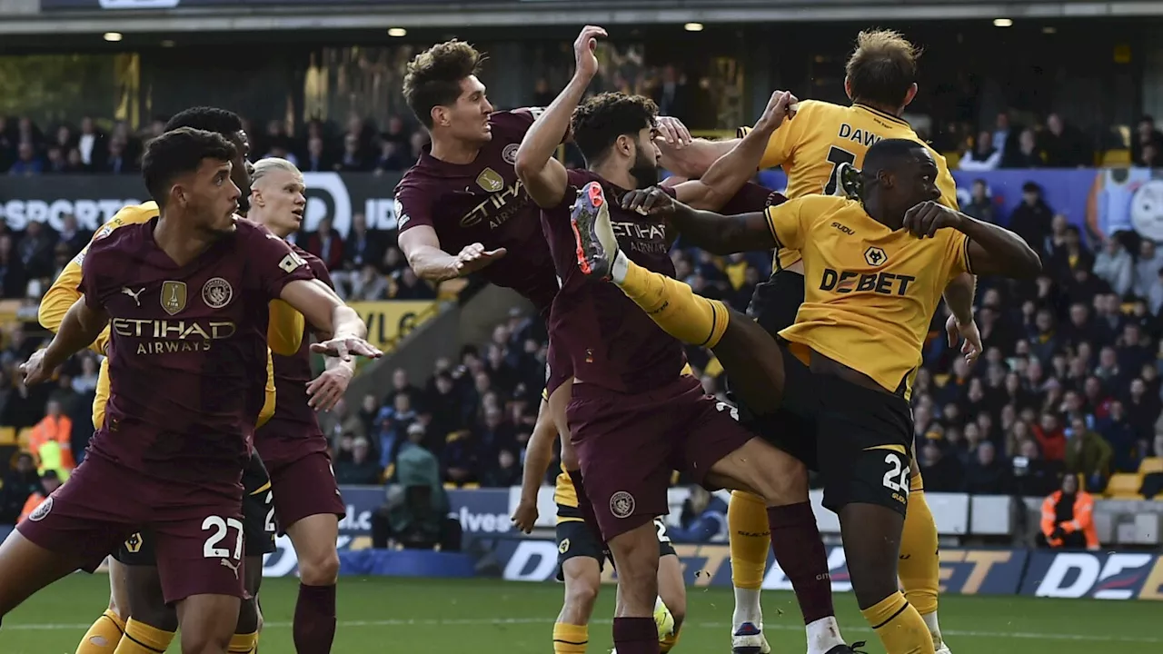 Stones scores injury-time winner as Man City beats struggling Wolves 2-1 in Premier League