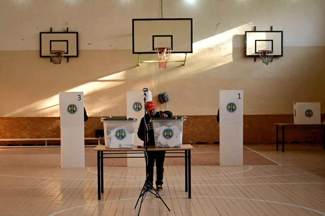 Moldova votes in election, EU referendum in shadow of alleged Russian meddling