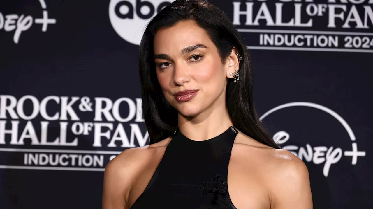 Dua Lipa's Black Leather Dress Featured Not One, But Two Hip-High Slits