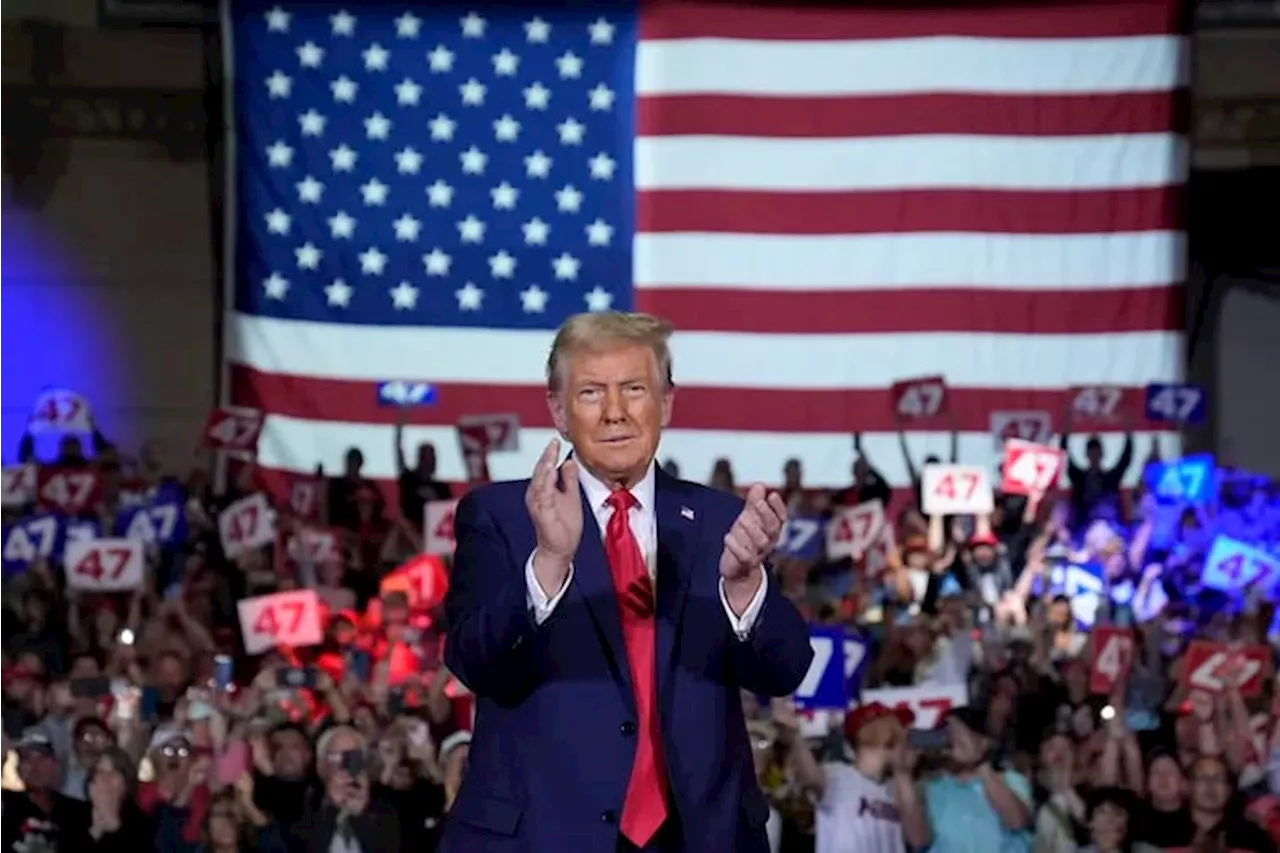 Donald Trump meets a friendly crowd at Lancaster town hall amid busy campaigning day in Pennsylvania