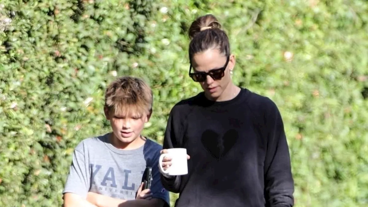 Jennifer Garner keeps it casual in sweatshirt and leggings as she enjoys a sunny walk with...