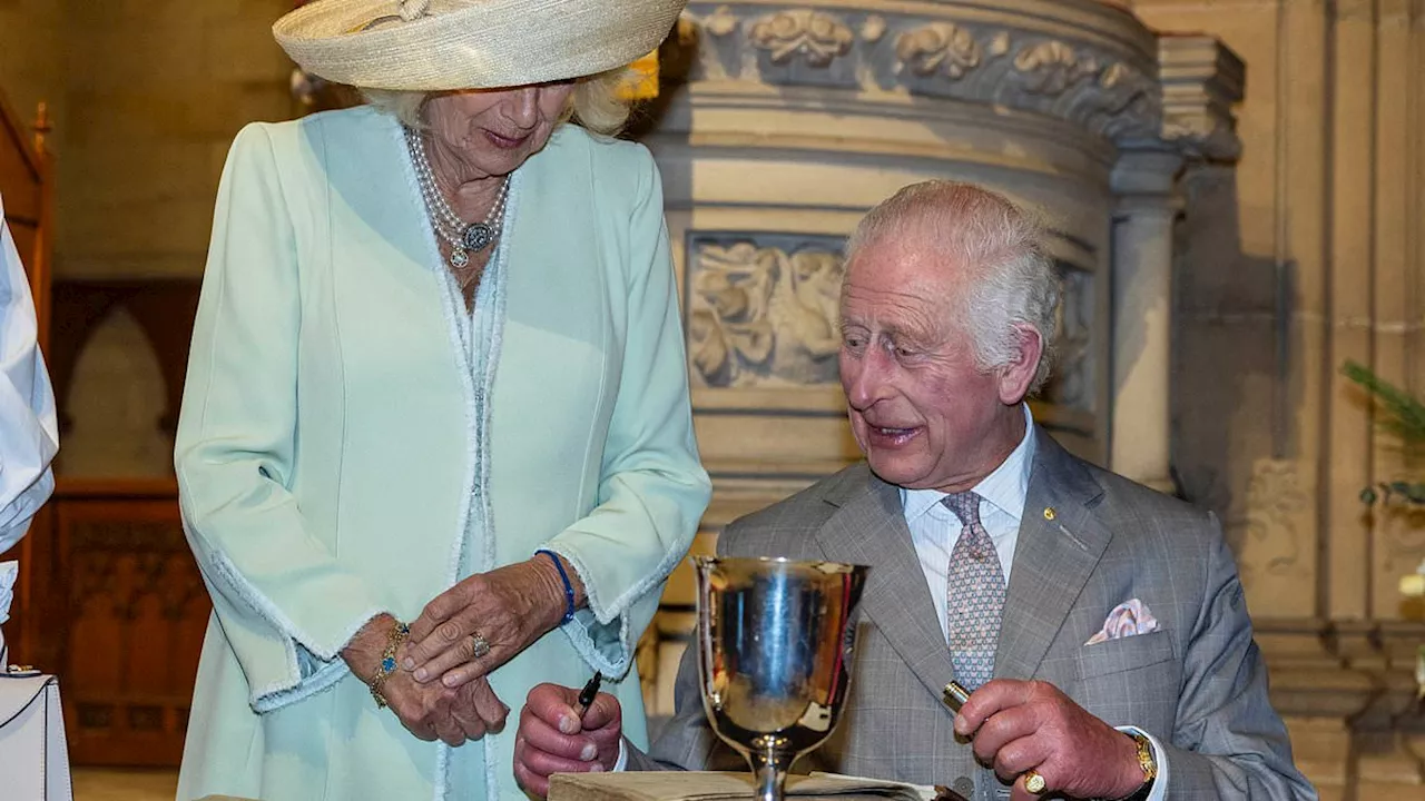 Ghosts of the past for Charles and Camilla as they sign Bible on tour