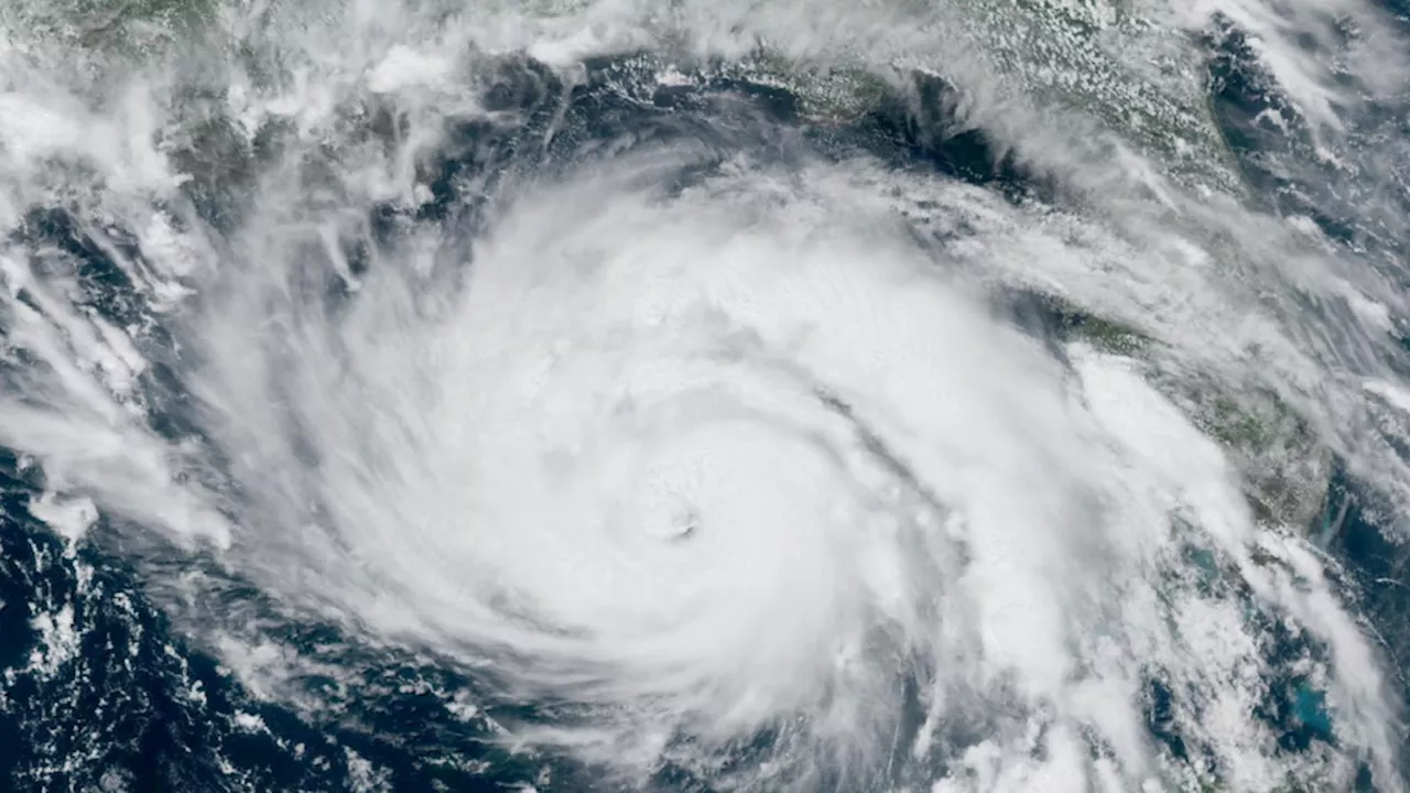 Florida digs out of mountains of sand swept in by back-to-back hurricanes