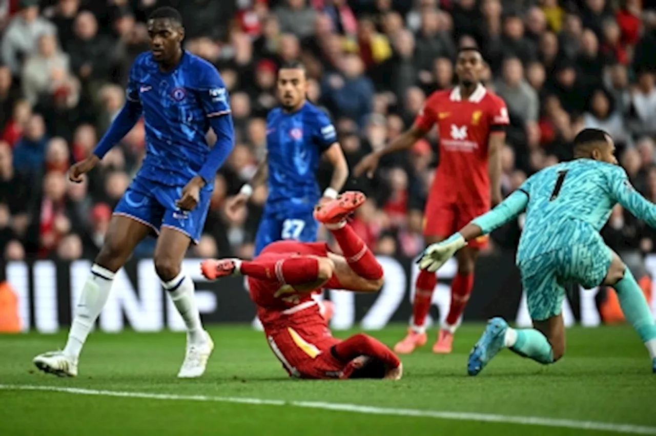 Liverpool pass Chelsea test with 2-1 win after stretched to the limits at Anfield, goes top of Premier League table