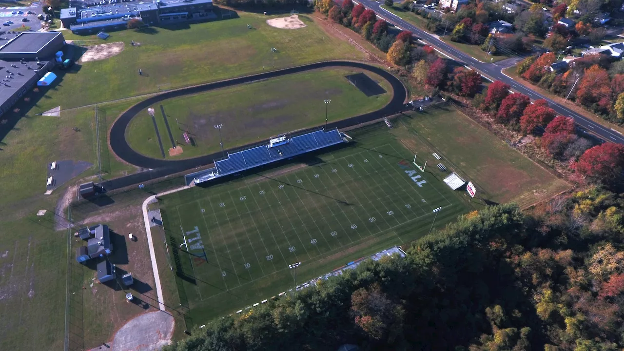 Woman charged with harassing HS football player on field after game, police say