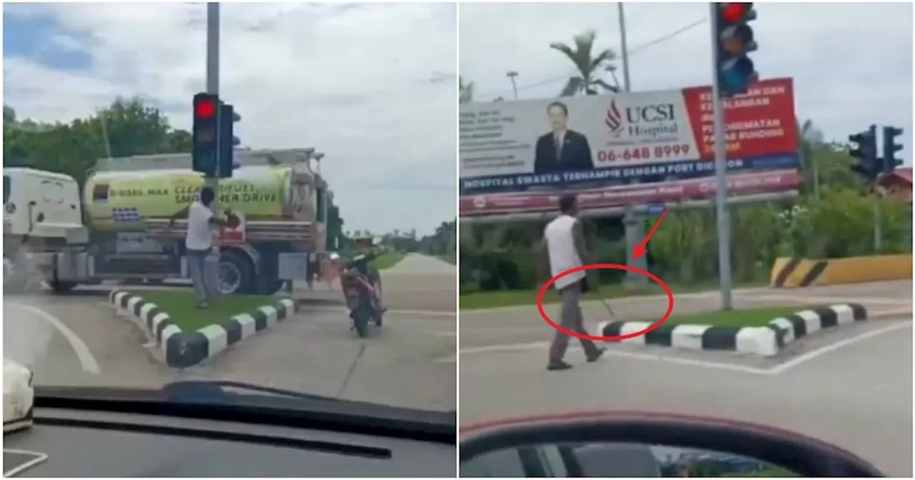 M'sian Arrested for Using a Parang to Vandalise Traffic Lights in Broad Daylight at Port Dickson