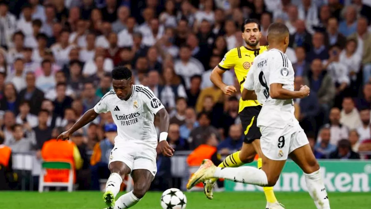 Vinicius treble helps Real Madrid rally to overcome Dortmund 5-2